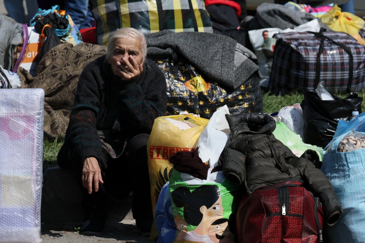 An elderly women sits