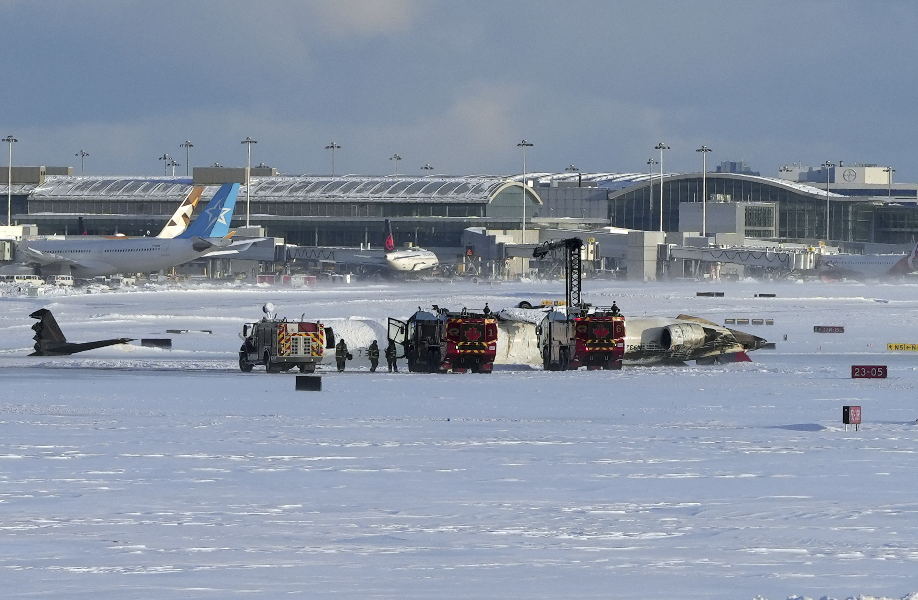 How did the crashed Toronto plane land upside down?