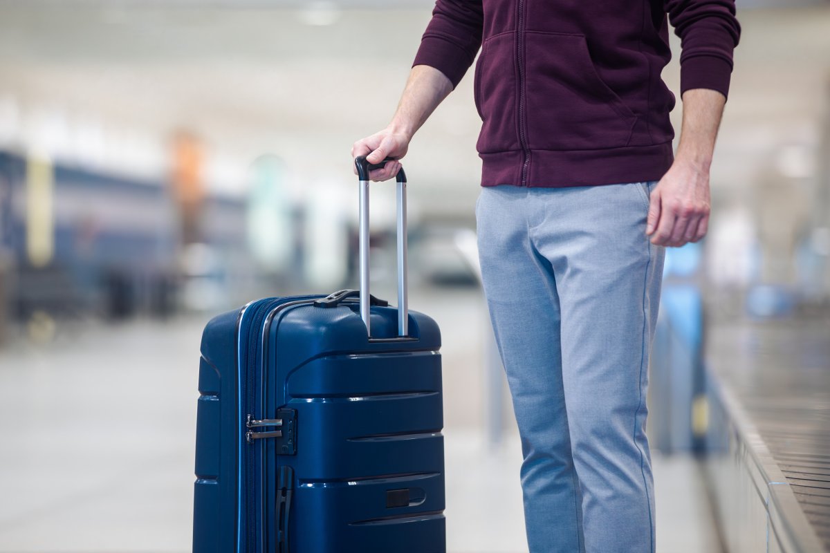 Man near the suitcase.