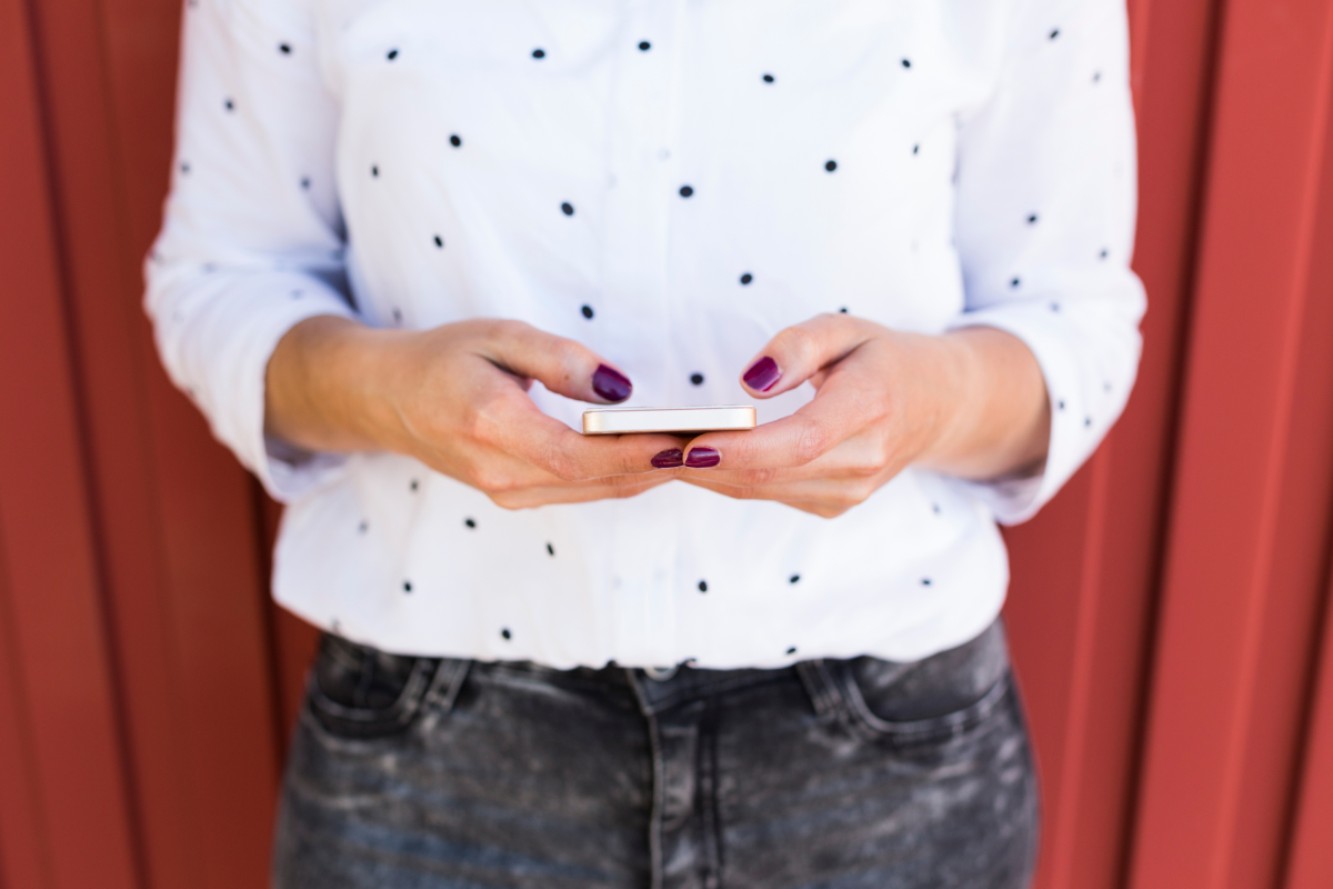Woman Painted Nails Polka Dot Shirt Phone
