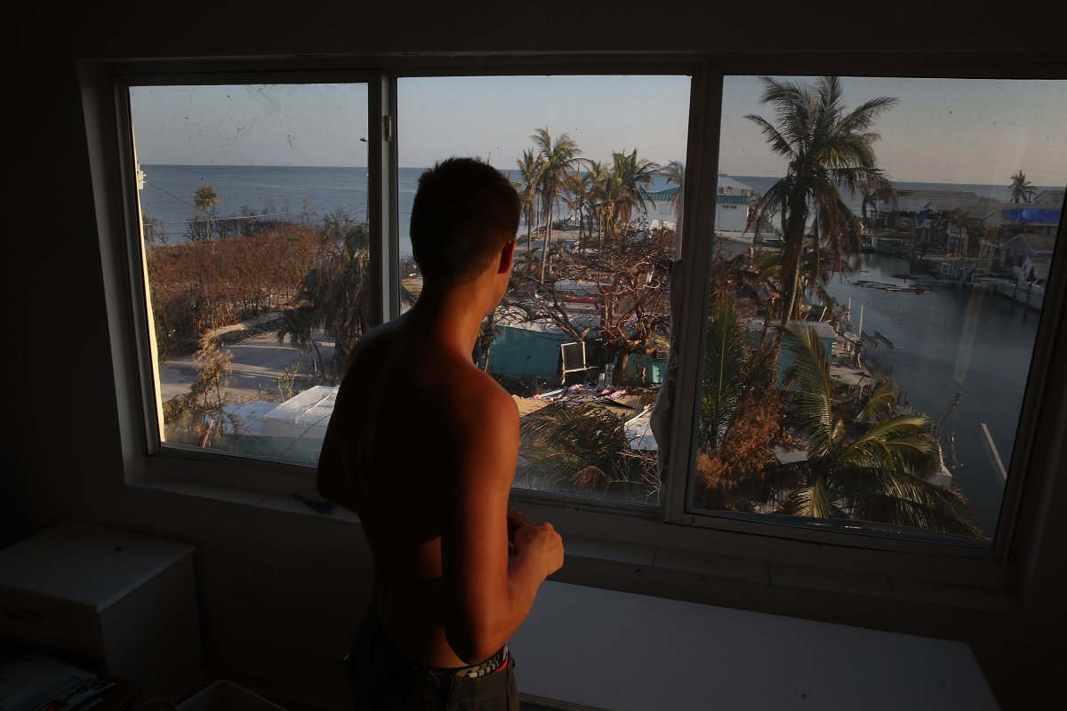 Markus Reinfandt looks out the third-story window of his home at mobile homes that were destroyed by Hurricane Irma on September 18, 2017, in Marathon, Florida.