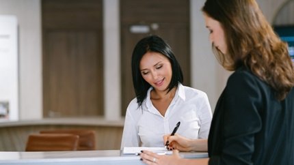 Women at hotel reception