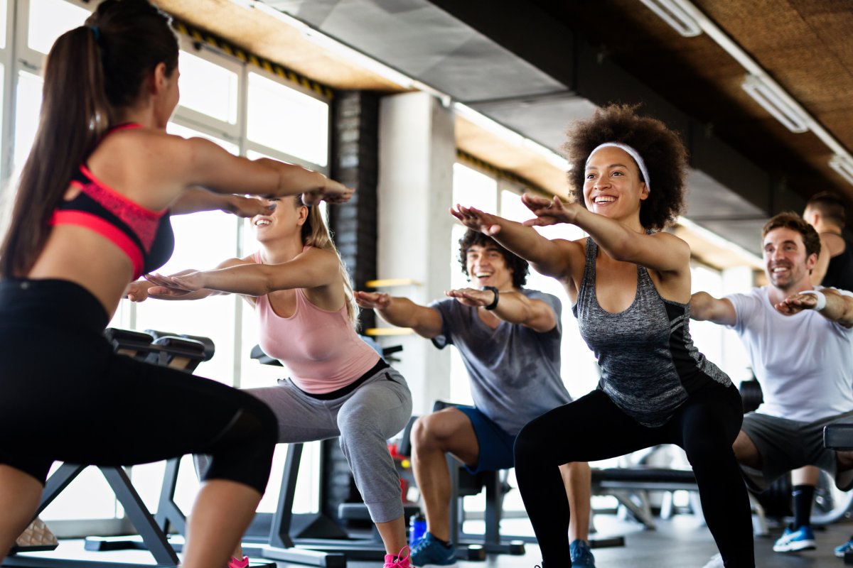 People exercising together at a gym.