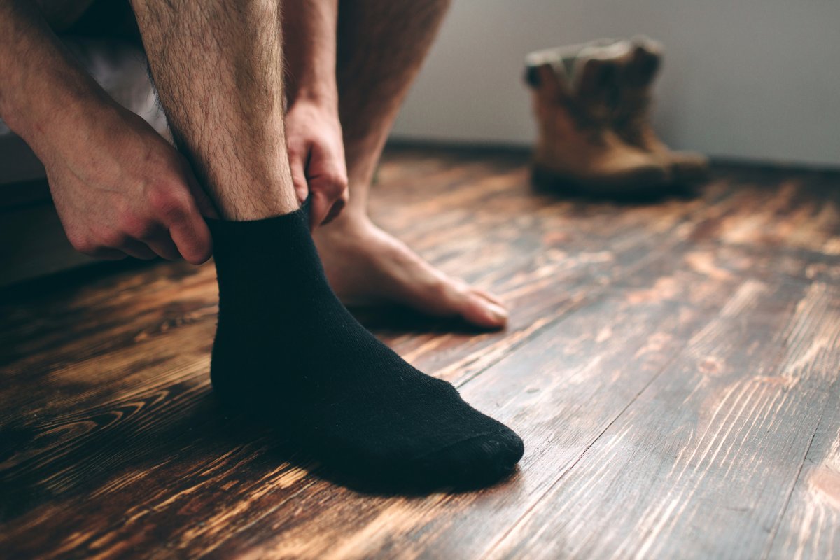 A man puts socks on
