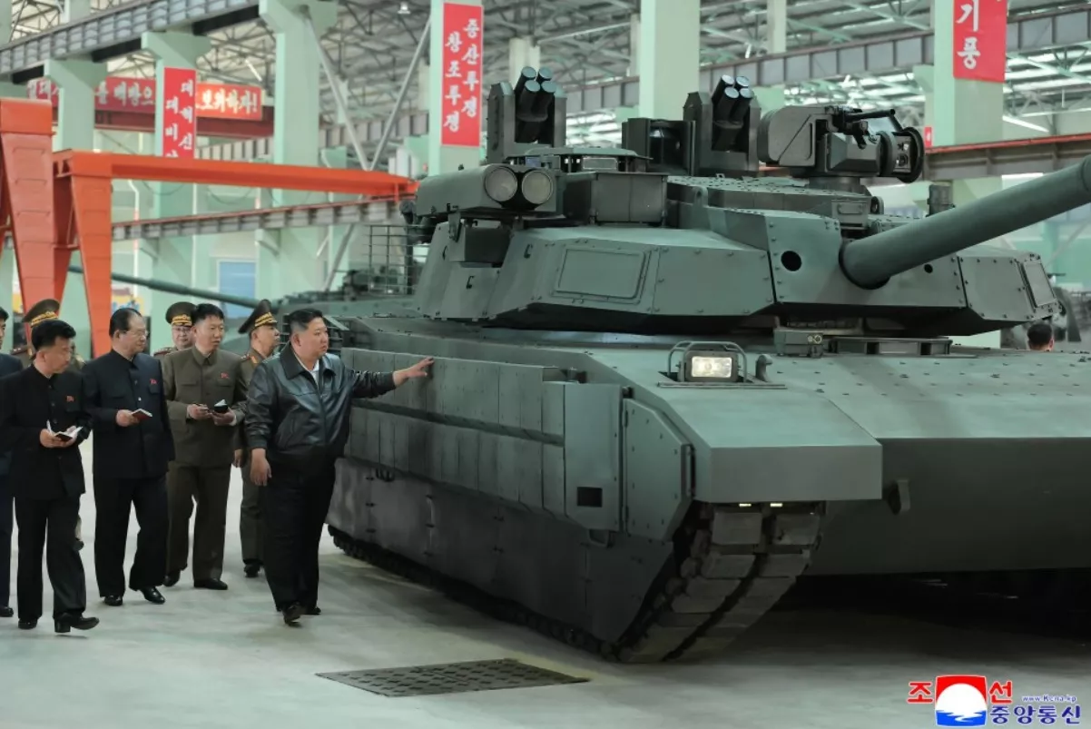 https://d.newsweek.com/en/full/2638481/kim-visits-tank-factory.webp