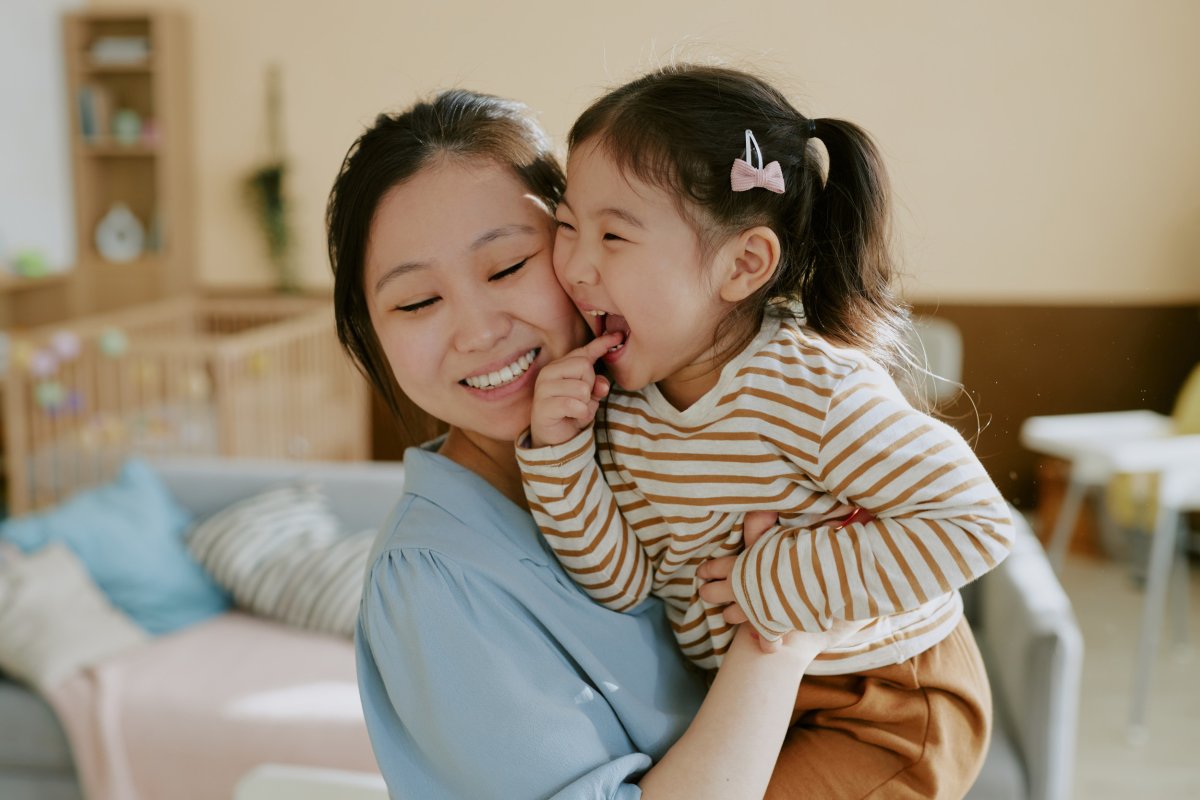 Portrait of Mother Hugging Her Daughter