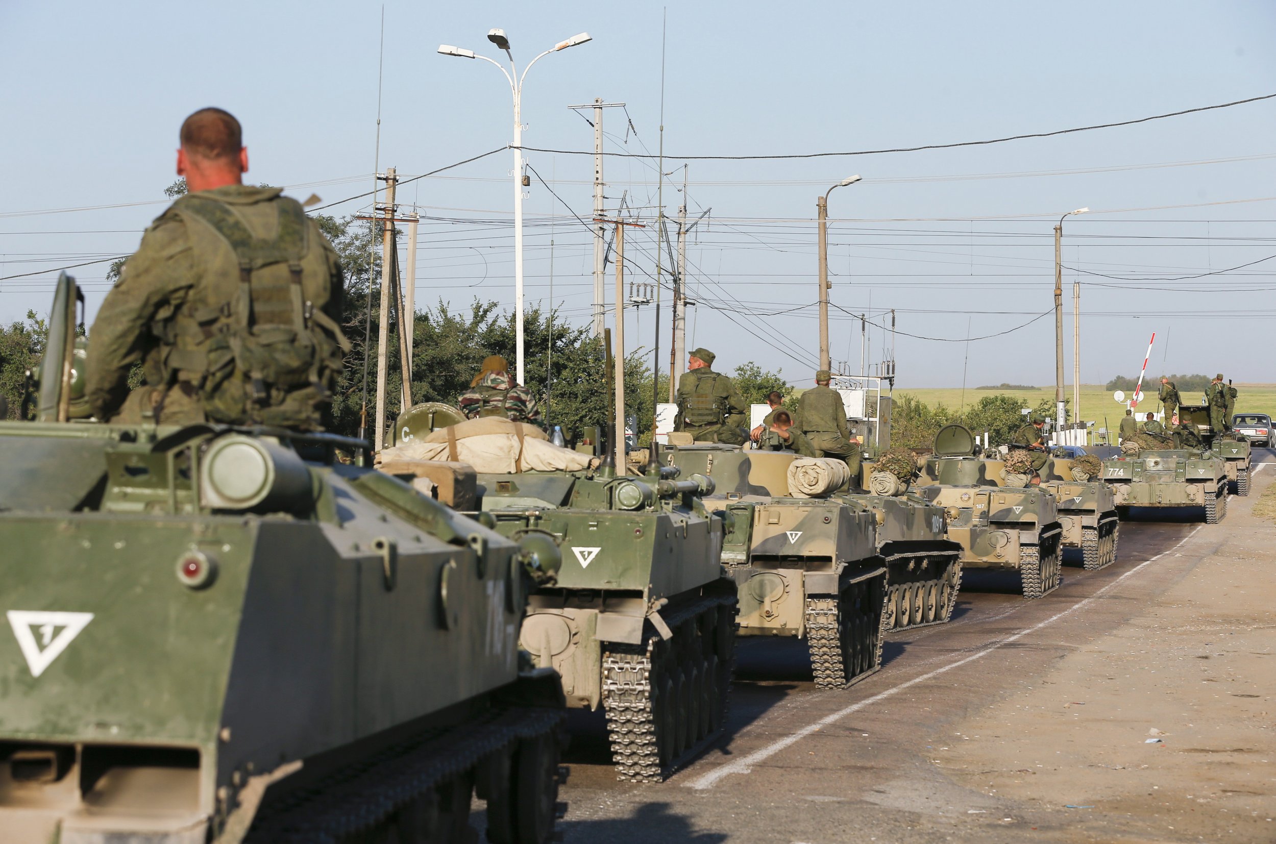 Russian Military Vehicles Enter Ukraine Overnight as 'Aid' Convoy Waits  Near Border