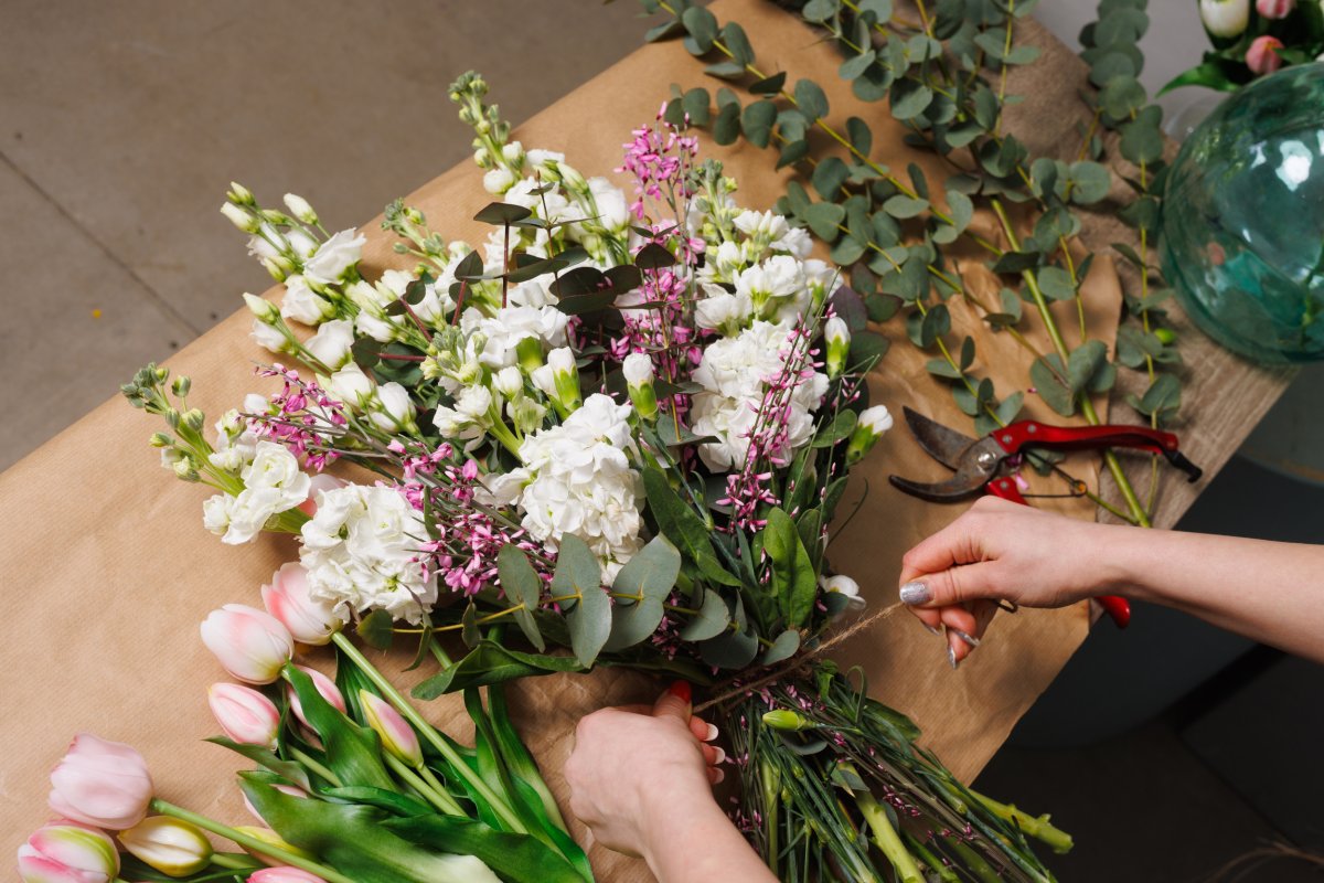 Person preparing flowers