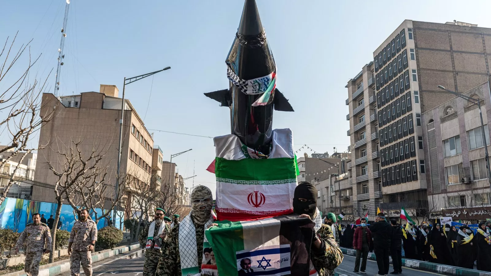 https://d.newsweek.com/en/full/2661663/iran-flag-parade.webp?w=1600&h=900&q=88&f=a633653ecddd5d851a43c0cce8fc421f