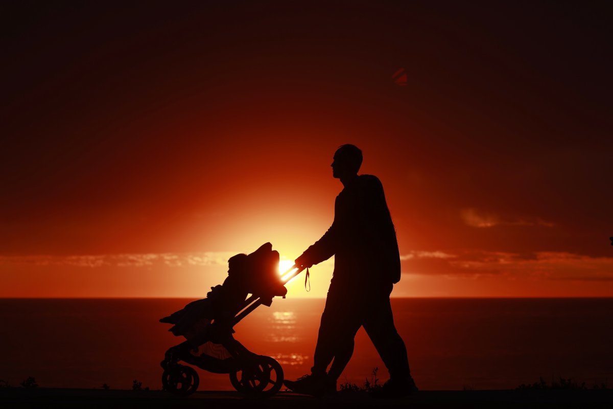 couple pushes stroller