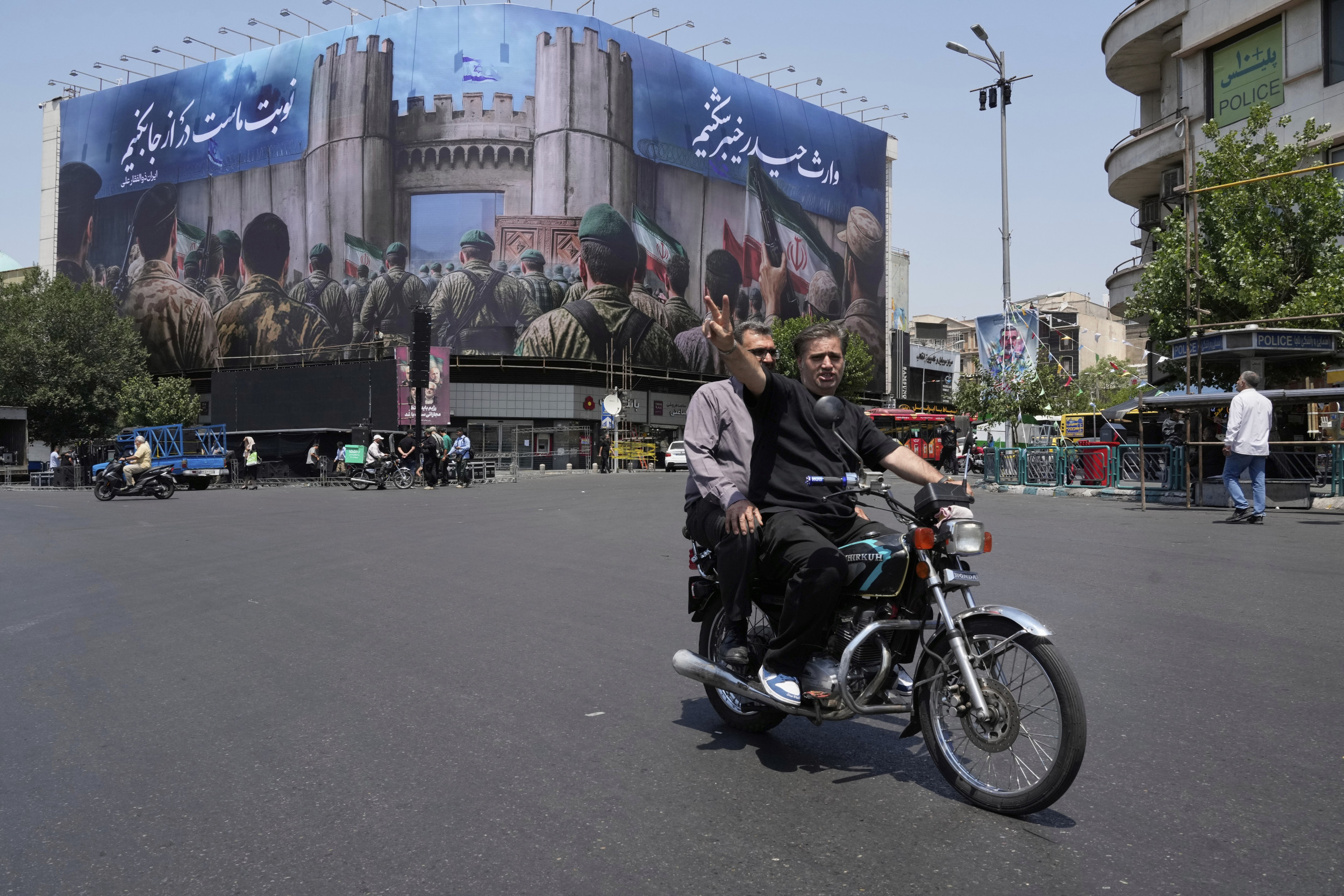 https://d.newsweek.com/en/full/2663690/man-bike-tehran.jpg