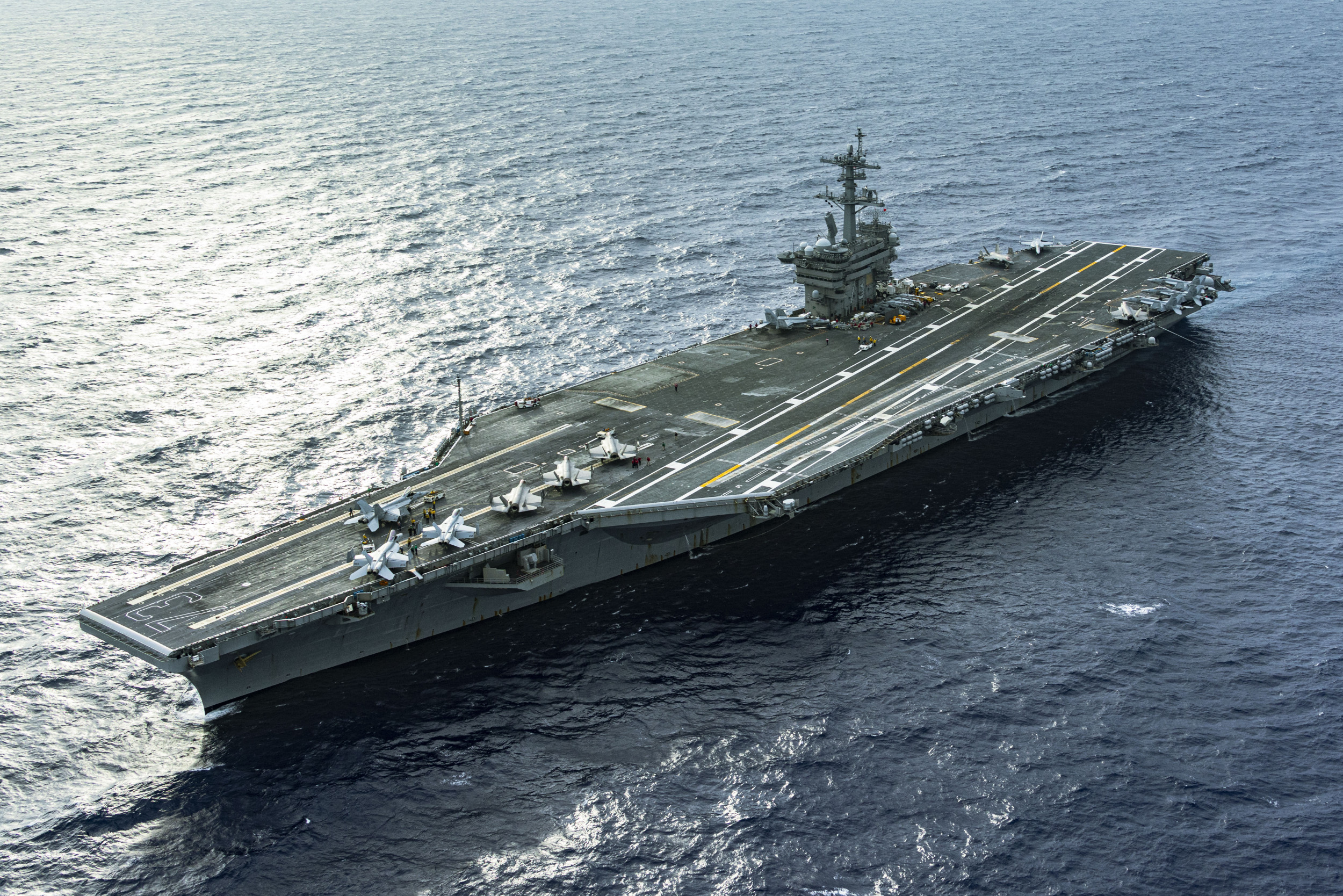 https://d.newsweek.com/en/full/2664710/us-navy-aircraft-carrier-transits-philippine-sea.jpg