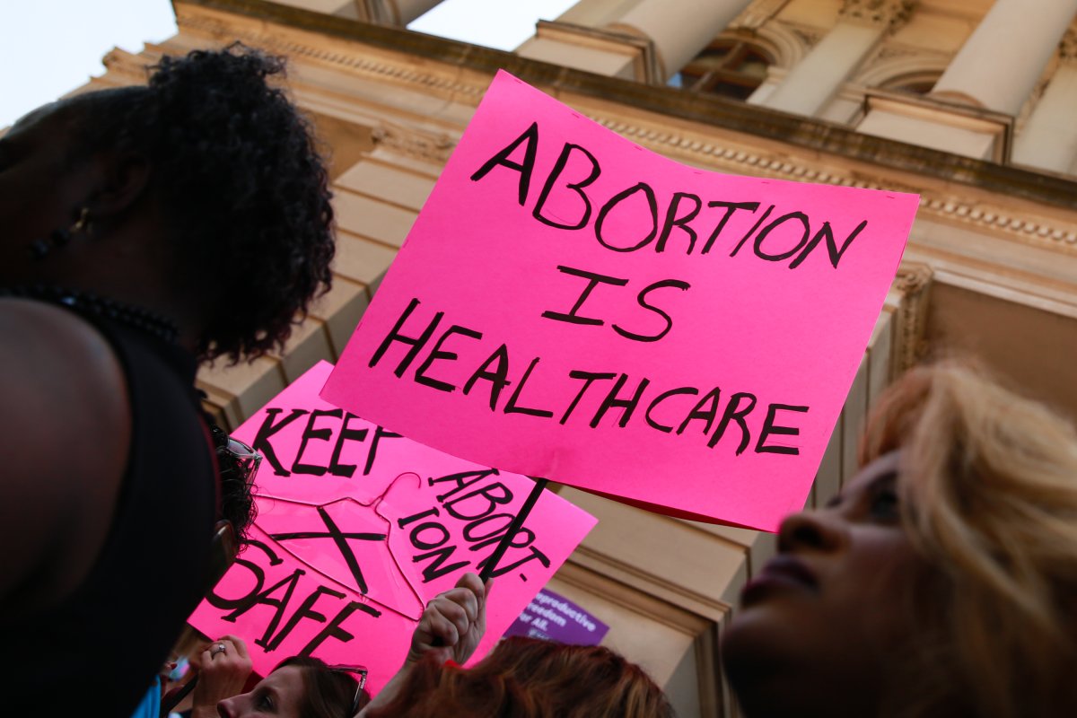 Baby Delivered from Brain-Dead Georgia Woman Amid Abortion Law Controversy 4 Brain Dead Woman's Baby Delivered After Abortion Law Forced Her Kept Alive - Newsweek