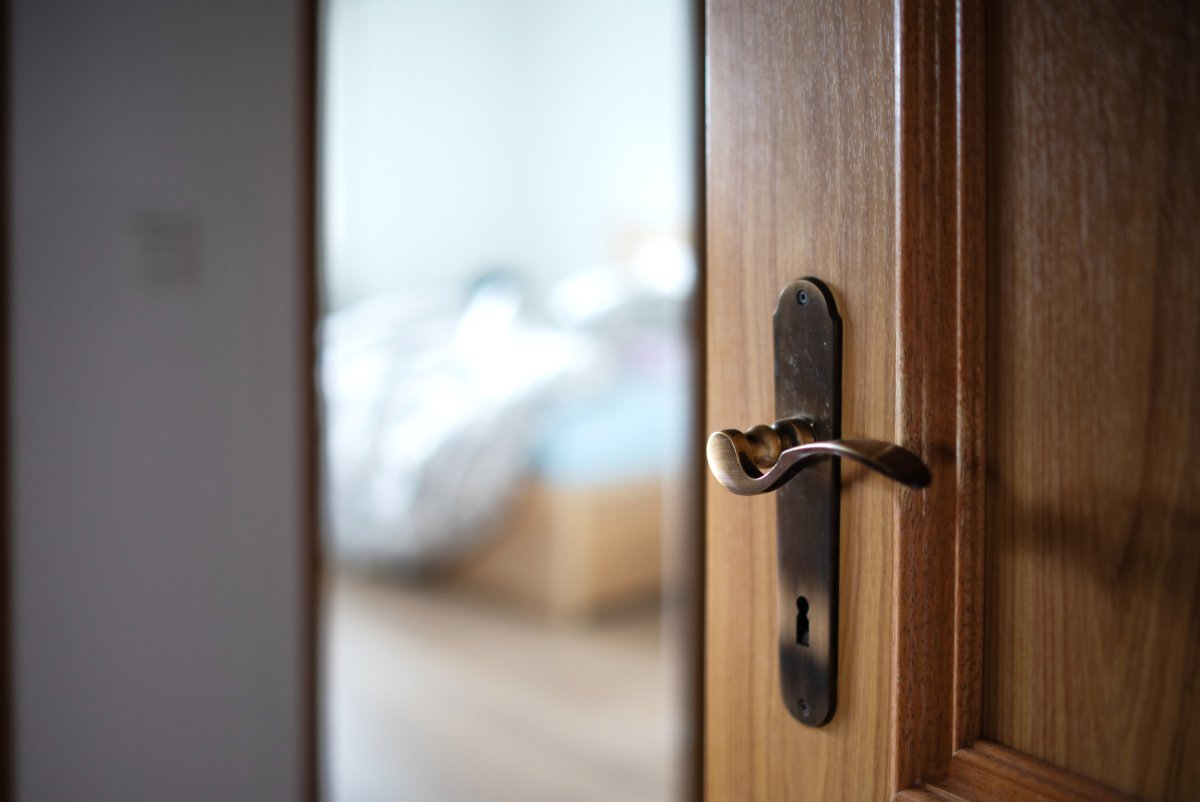 Wooden Door Opens Bedroom