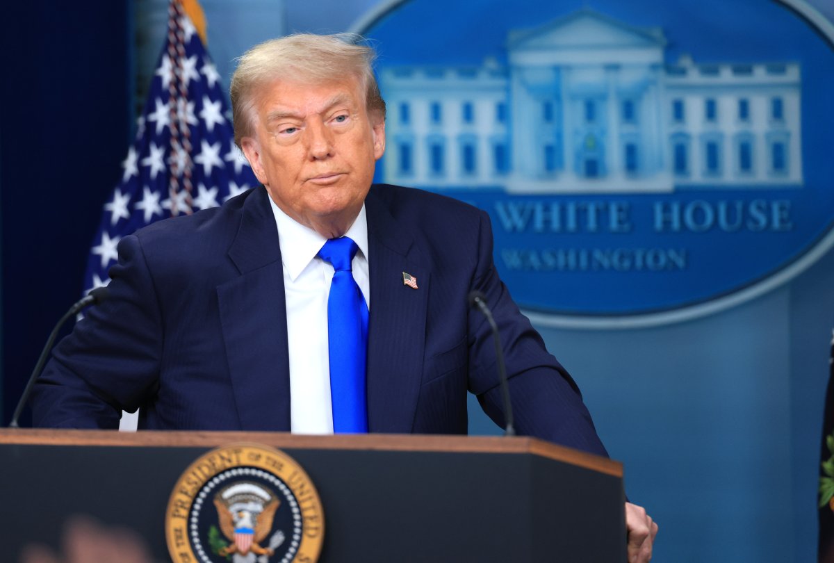 President Donald Trump answers questions during a