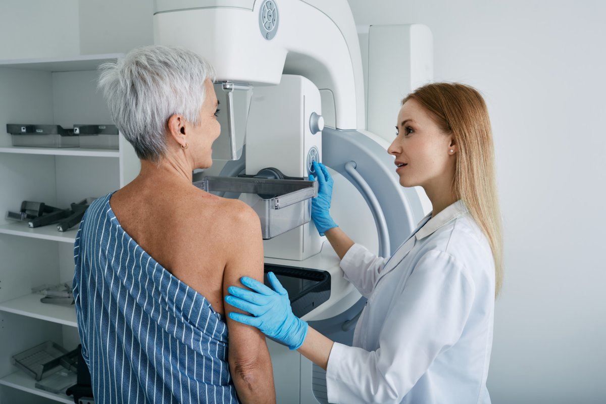 A woman undergoing a mammogram