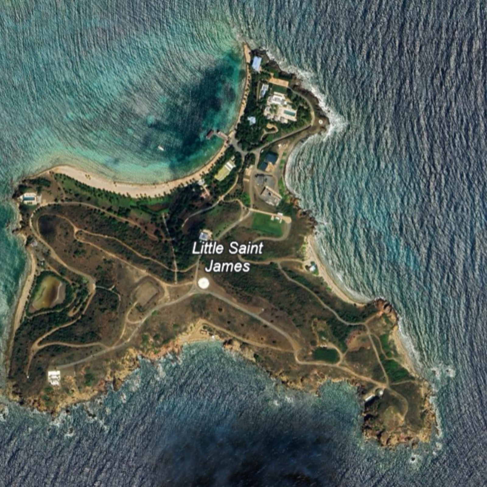 Aerial view of the private island of Jeffrey Epstein, Little Saint James, showing villas, quays and a tropical coast surrounded by turquoise waters