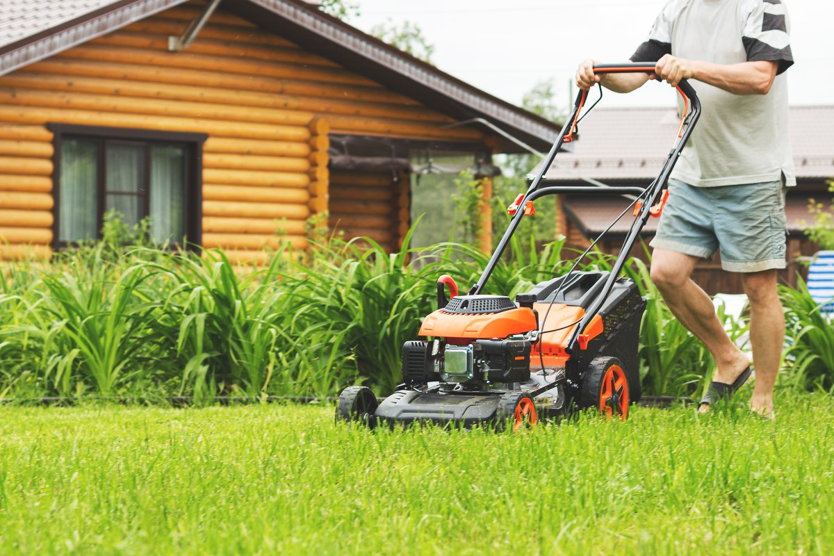Man mowing lawn.