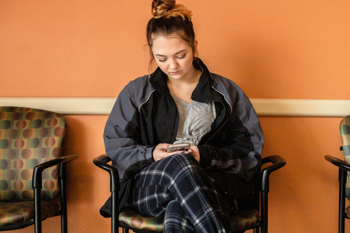 Woman on phone in waiting room