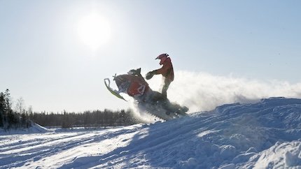 Snowbile racing and jumping stock