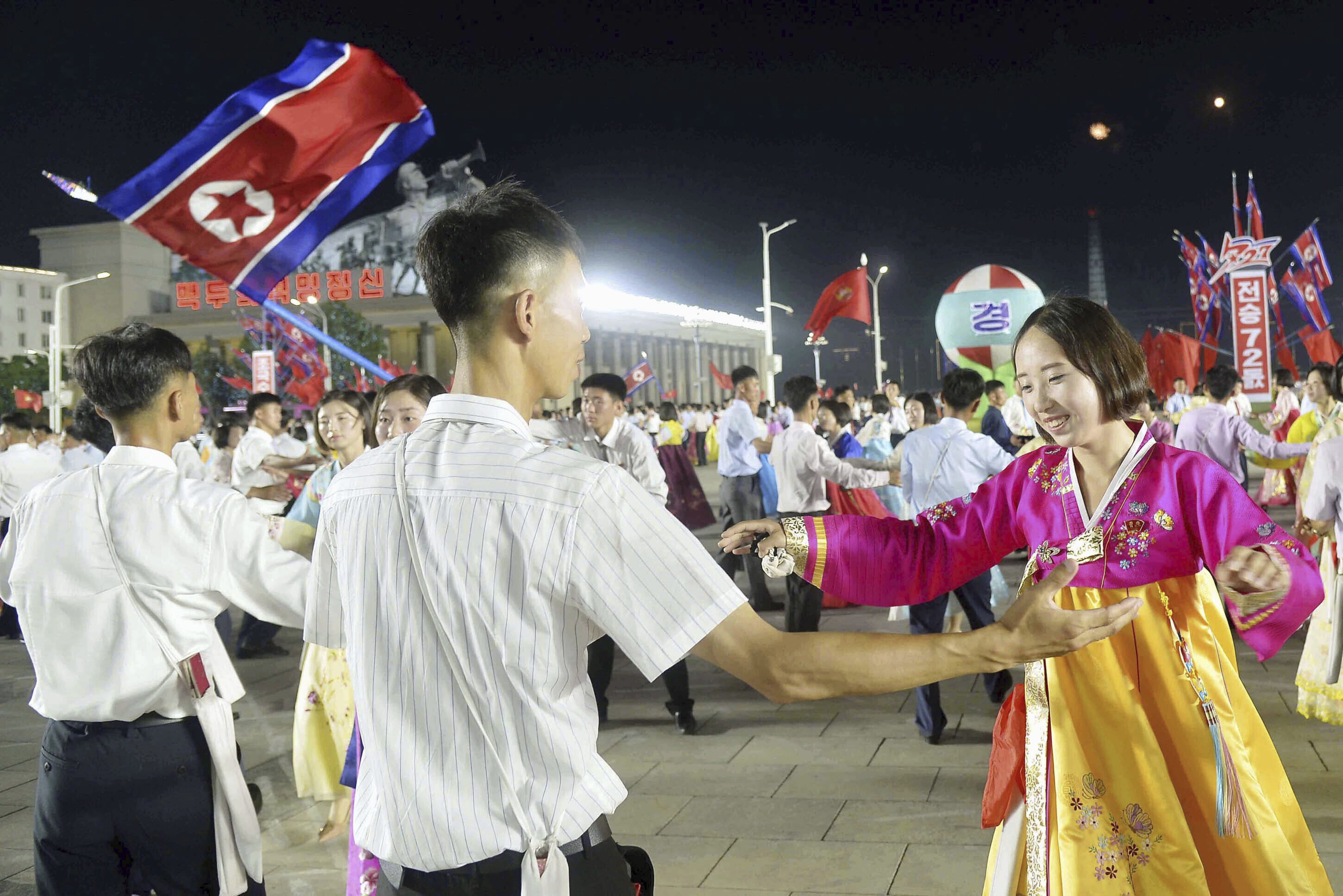 https://d.newsweek.com/en/full/2692068/north-koreans-dance-armistice-anniversary-ball.jpg