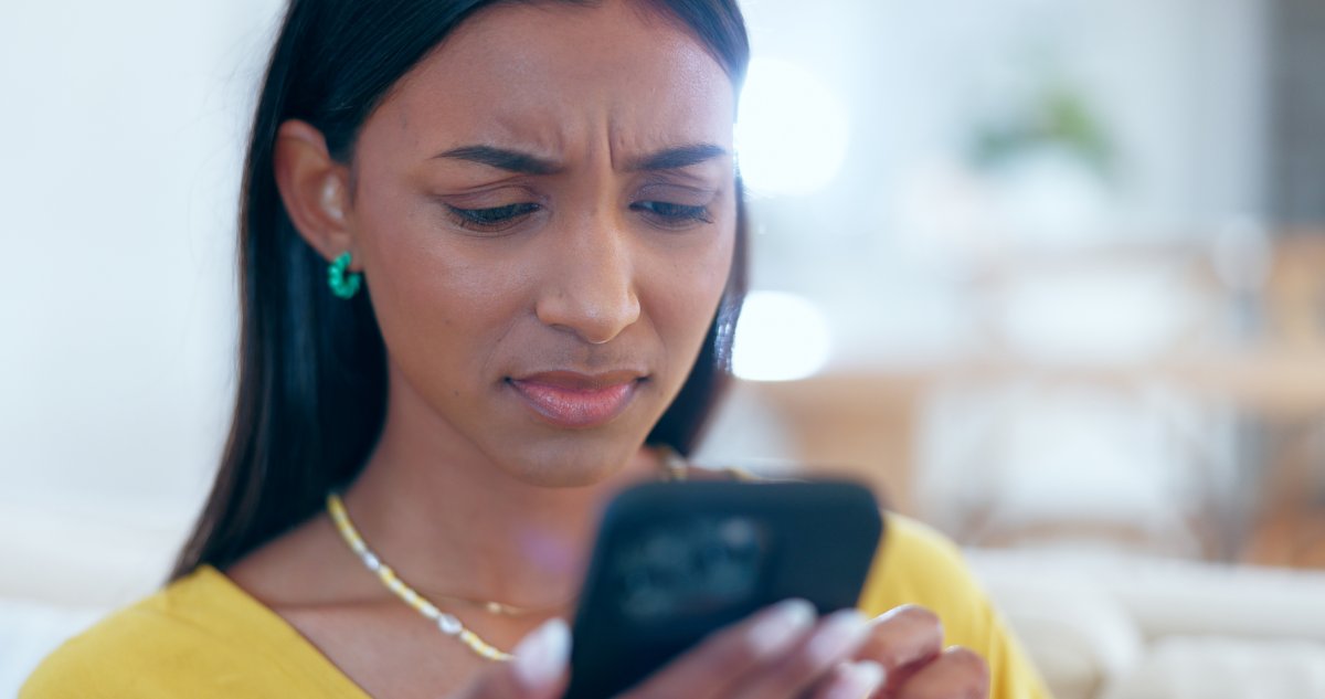 A woman confused at phone