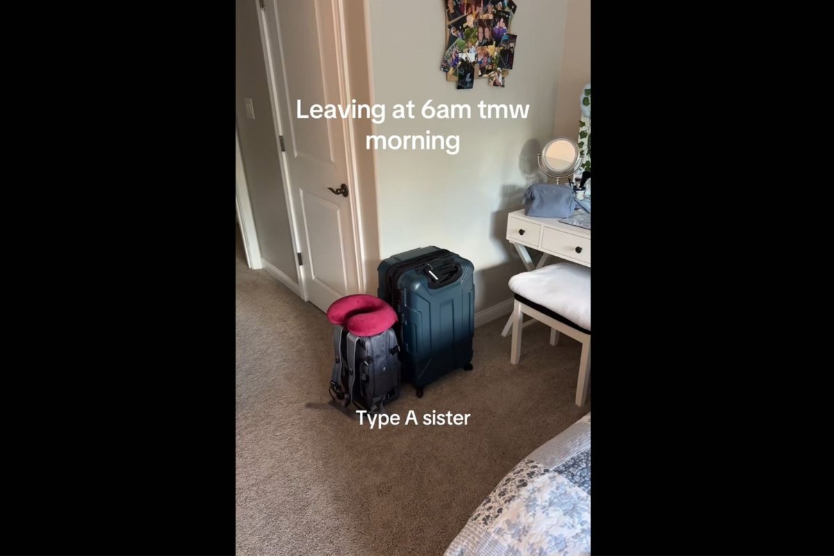 A packed suitcase and backpack in bedroom.