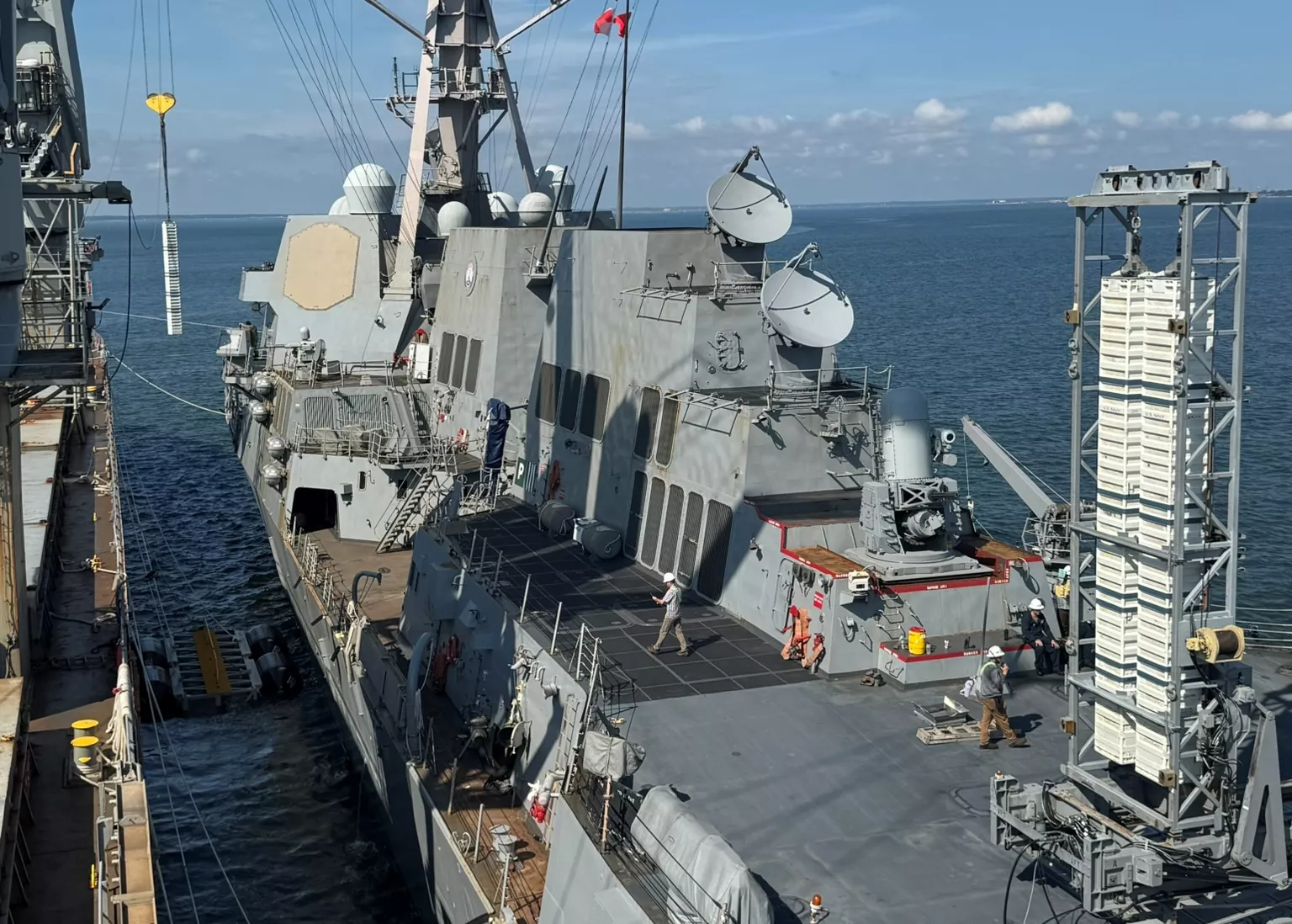 https://d.newsweek.com/en/full/2694537/us-destroyer-reloads-missile-canisters.webp