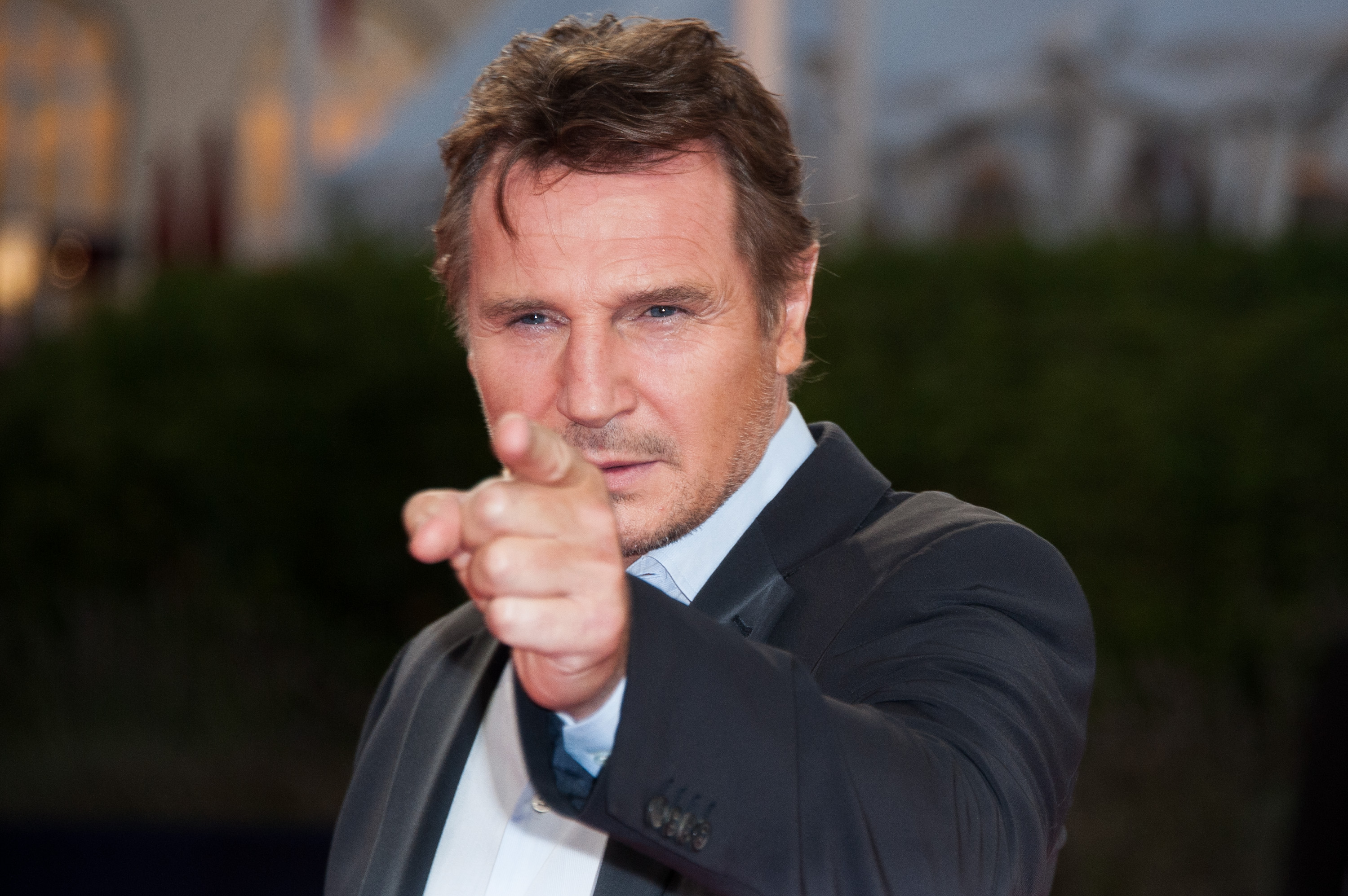 Liam Neeson Kisses Pamela Anderson in Naked Gun Promo, Reportedly Living Together