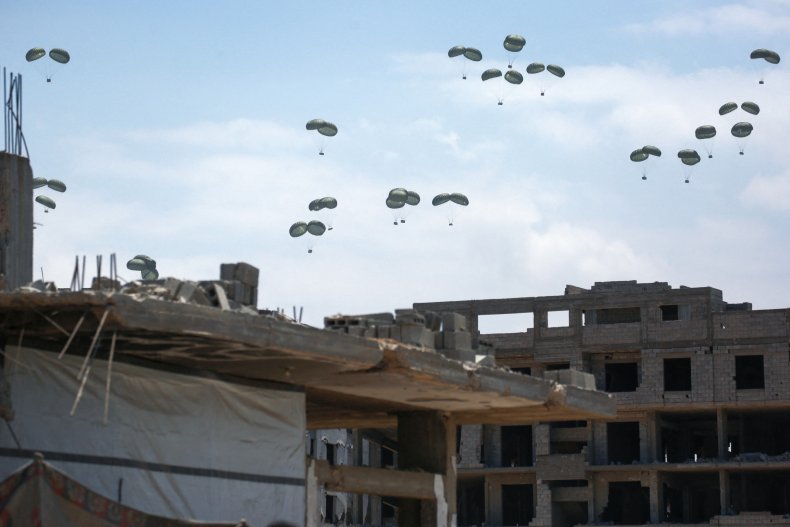 A picture taken in northern Gaza’s Jabalia shows aid parcels parachuted down following an airdrop above the Israel-besieged Palestinian territory on August 1.