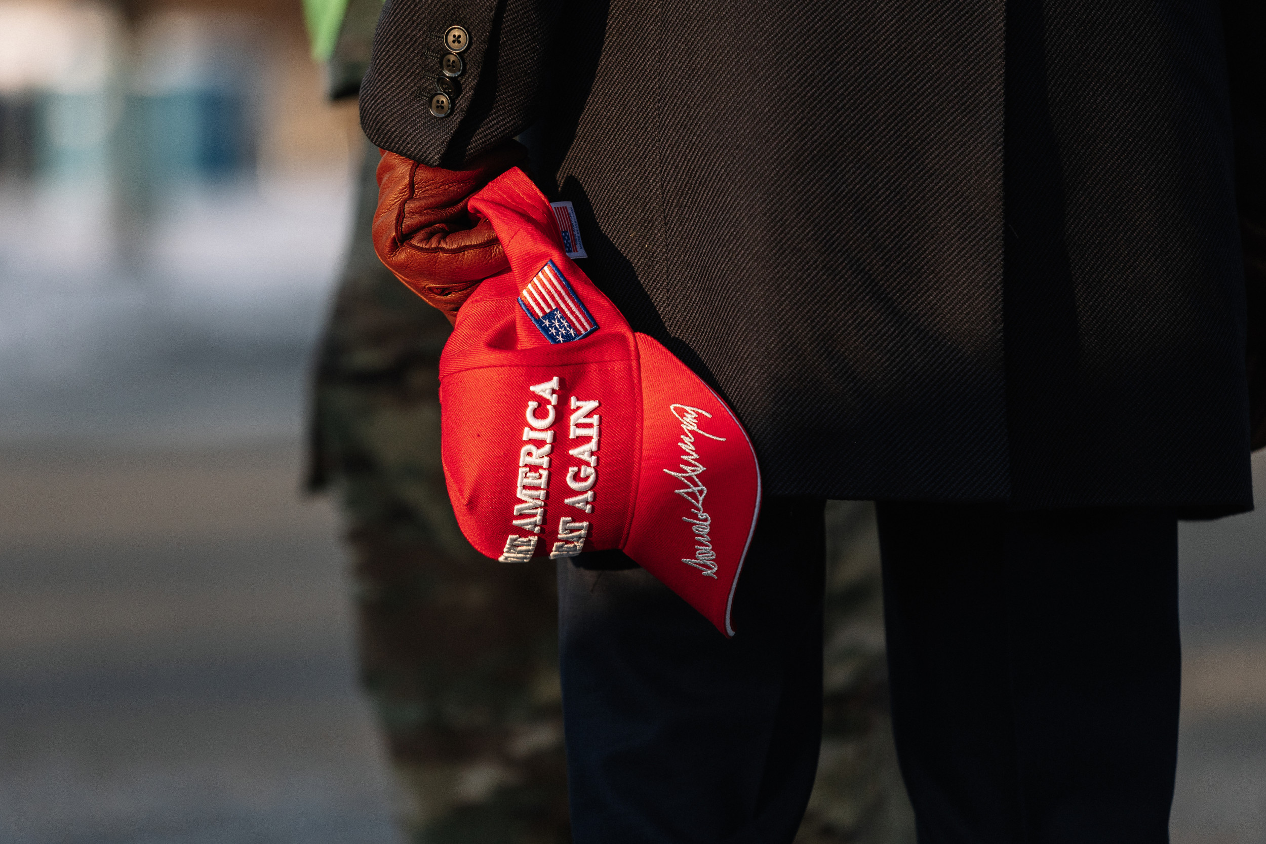 https://d.newsweek.com/en/full/2695873/pro-trump-supporter-holding-maga-hat.jpg