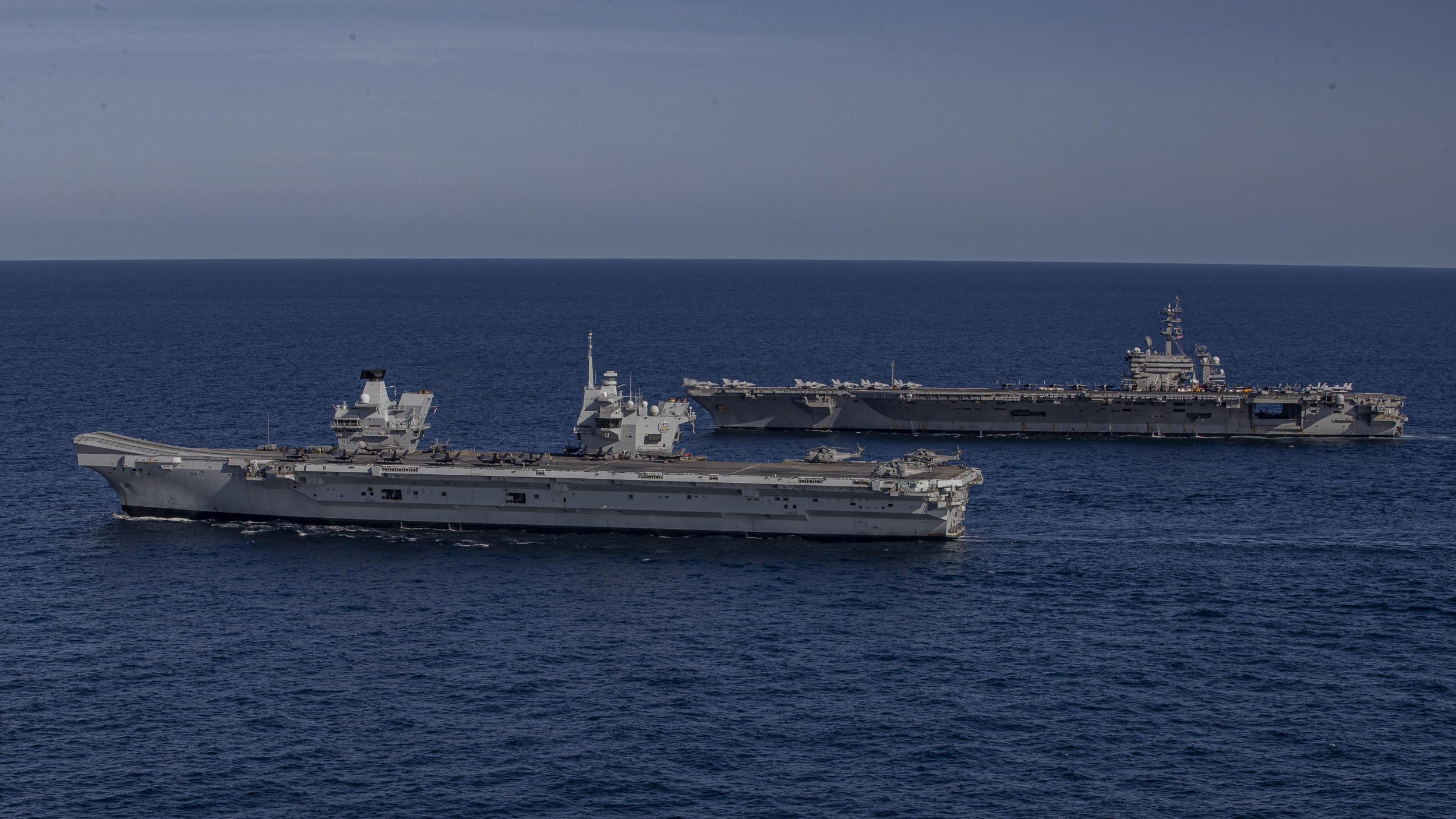 https://d.newsweek.com/en/full/2696542/joint-us-uk-carrier-strike-group.jpg