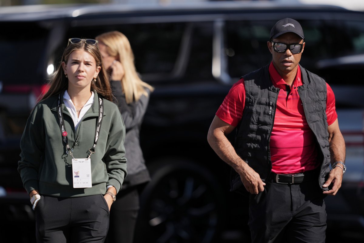 Kai Trump and Tiger Woods walking