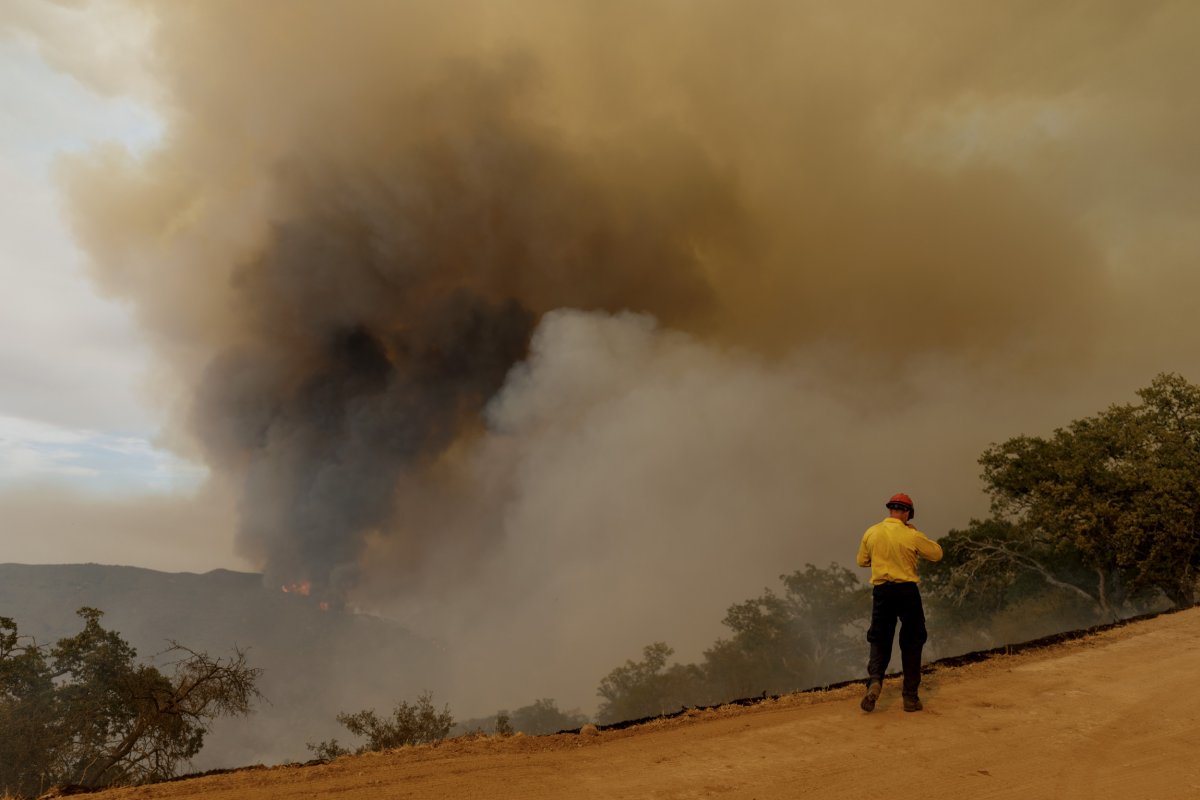A firefighter watches the Gifford Fire