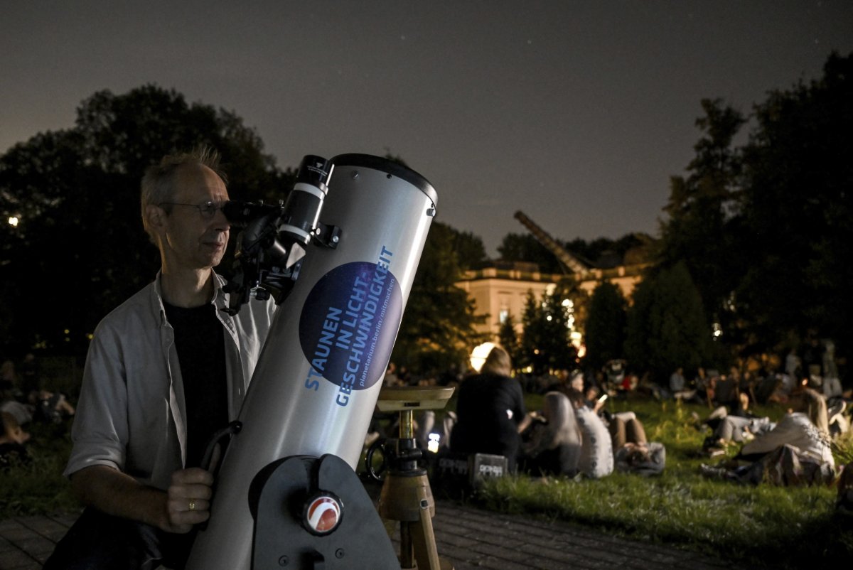 Astronomer Felix Lühning looks through his telescope