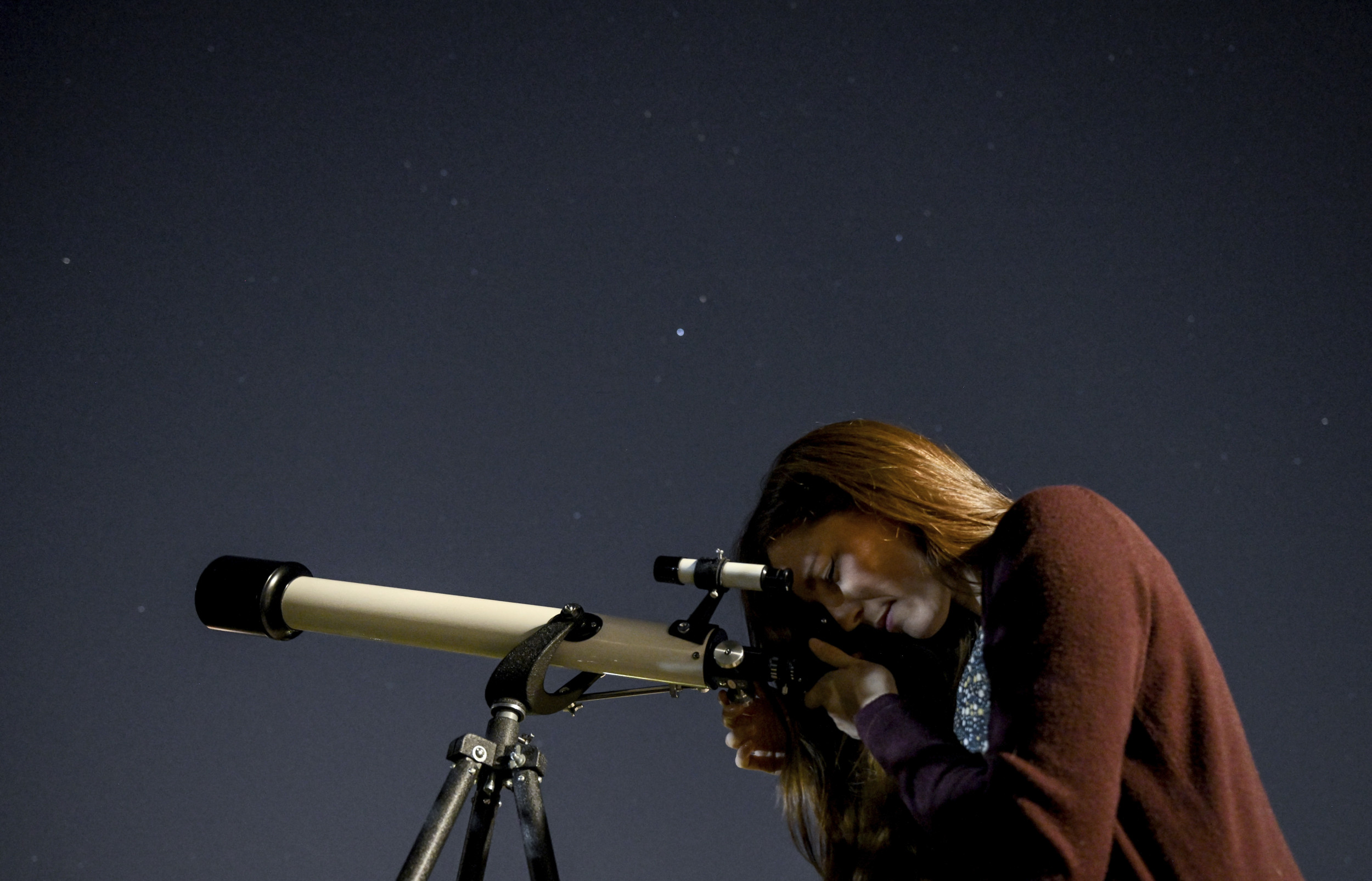 Sara looks through telescope at Archenhold Observatory