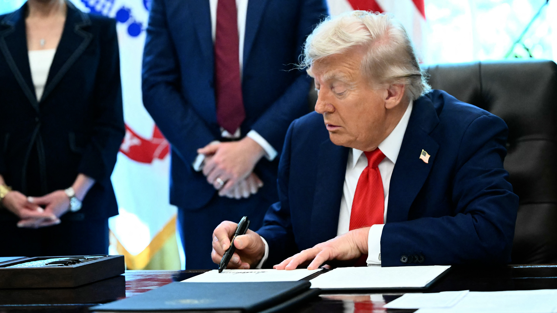 Trump signs executive order making flag burning