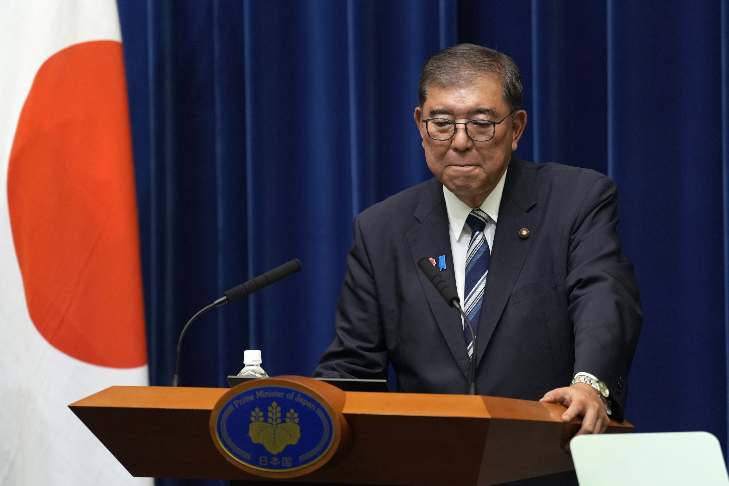 Japan's prime minister resigns after historic election defeat