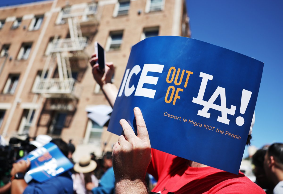 A person holds sign in LA