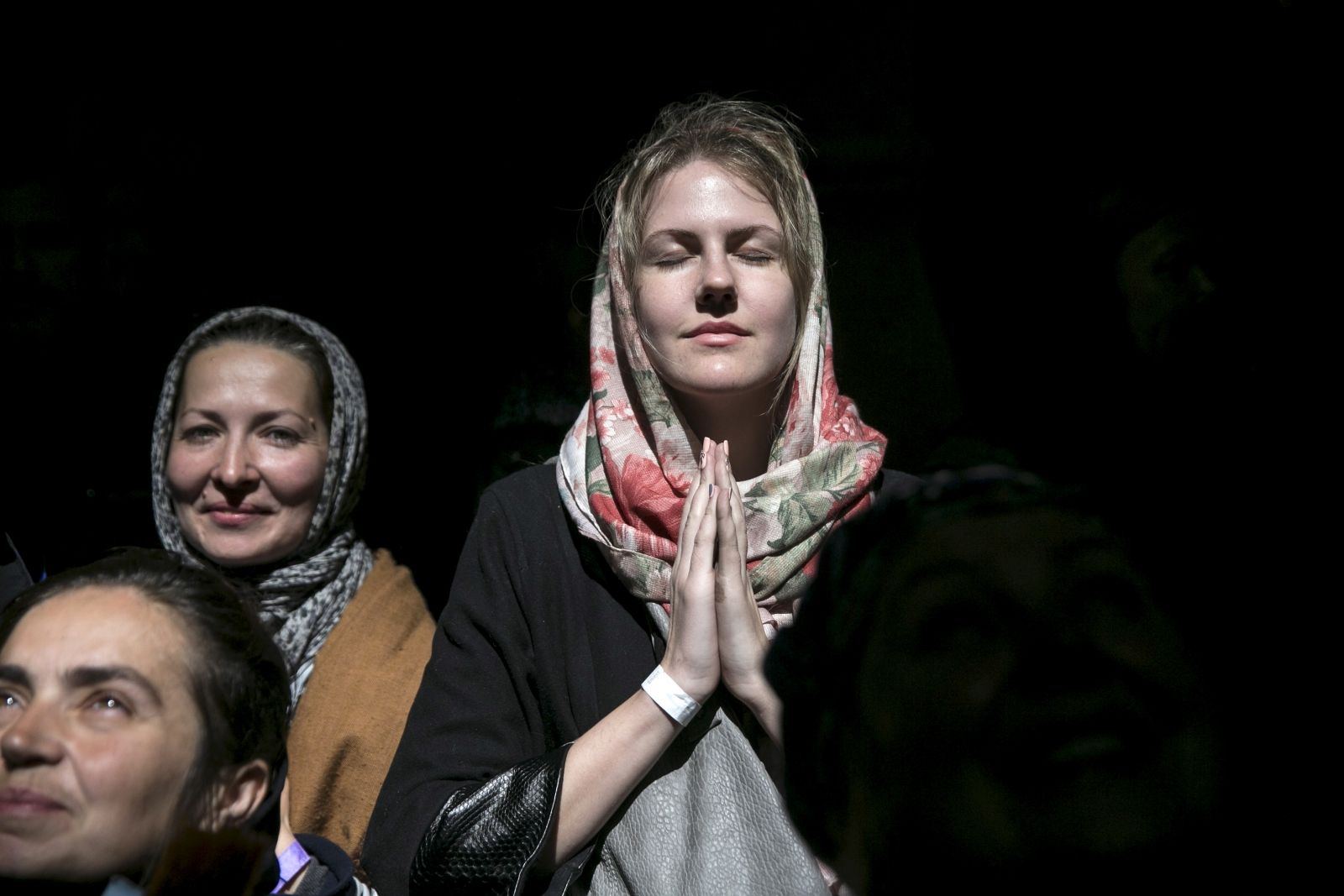 Church worshipper prays