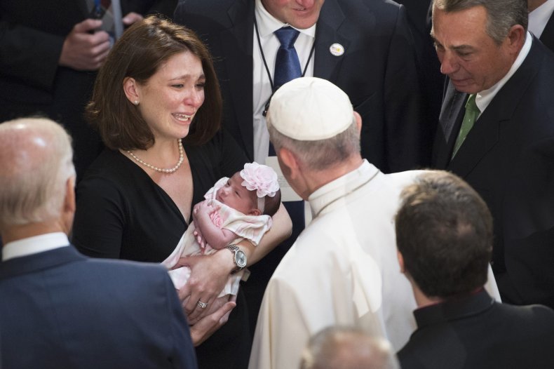 pope francis blesses a child
