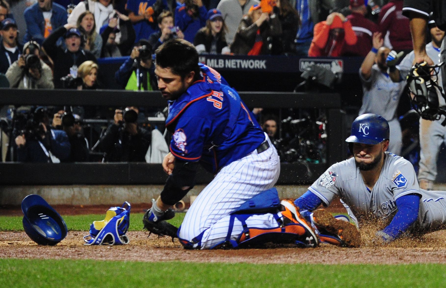 New York Mets second baseman Daniel Murphy (28) reacts after committing a  fielding error against the Kansas City Royals in the 12th inning in game  five of the World Series at Citi