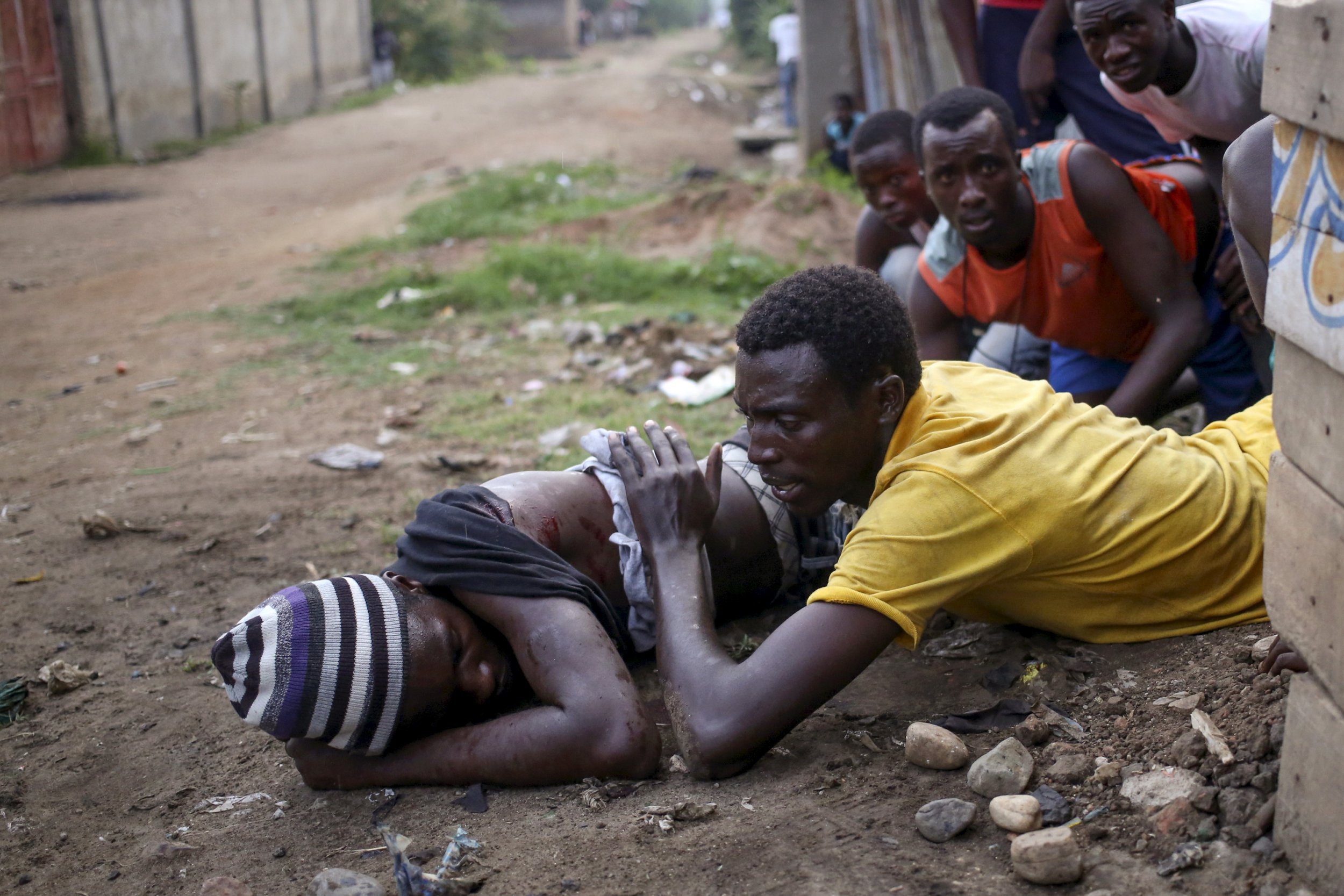 An anti-Nkurunziza protester lies wounded in Bujumbura, Burundi.