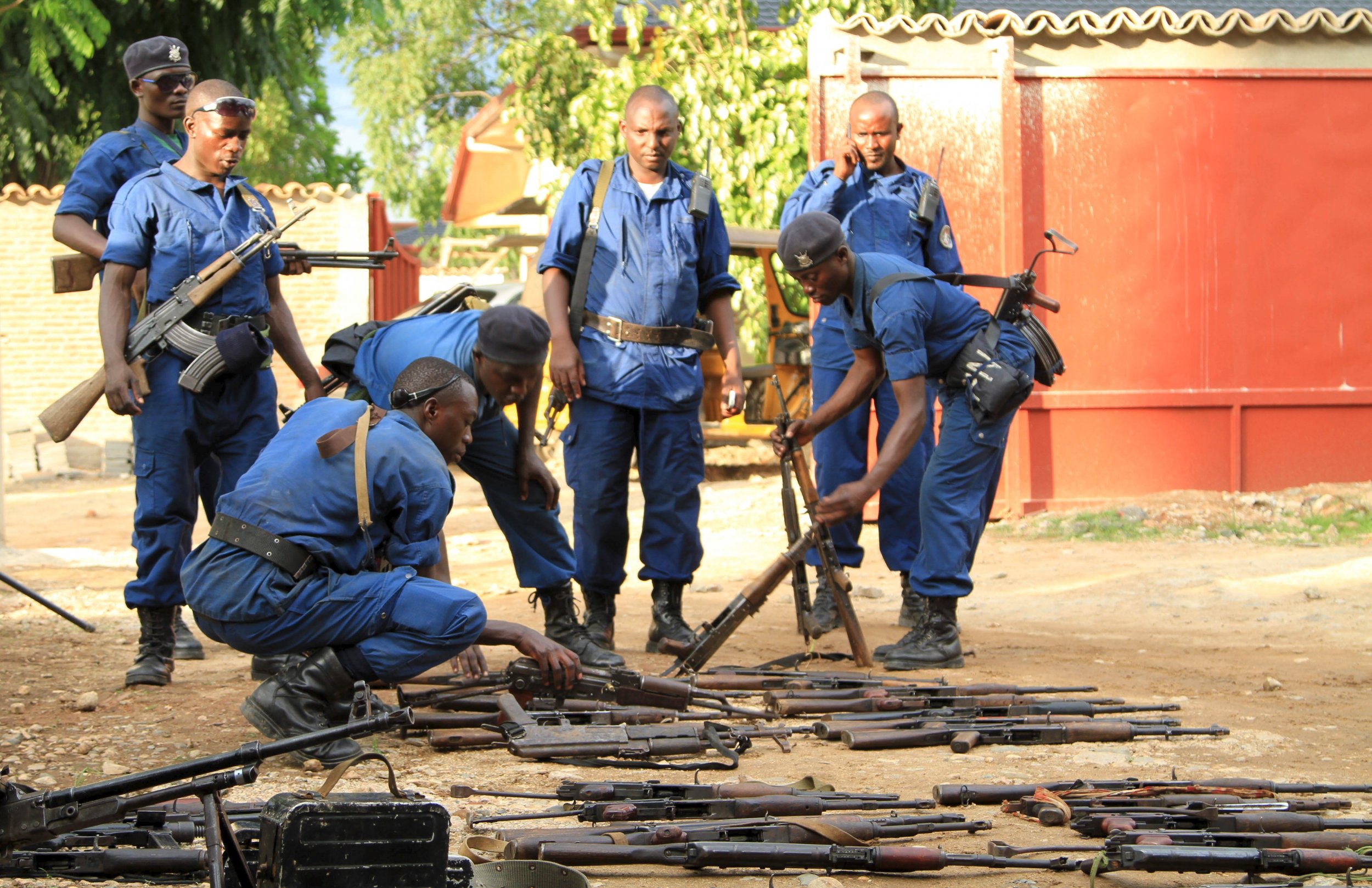 Burundi police collect weapons from suspected fighters in Bujumbura.