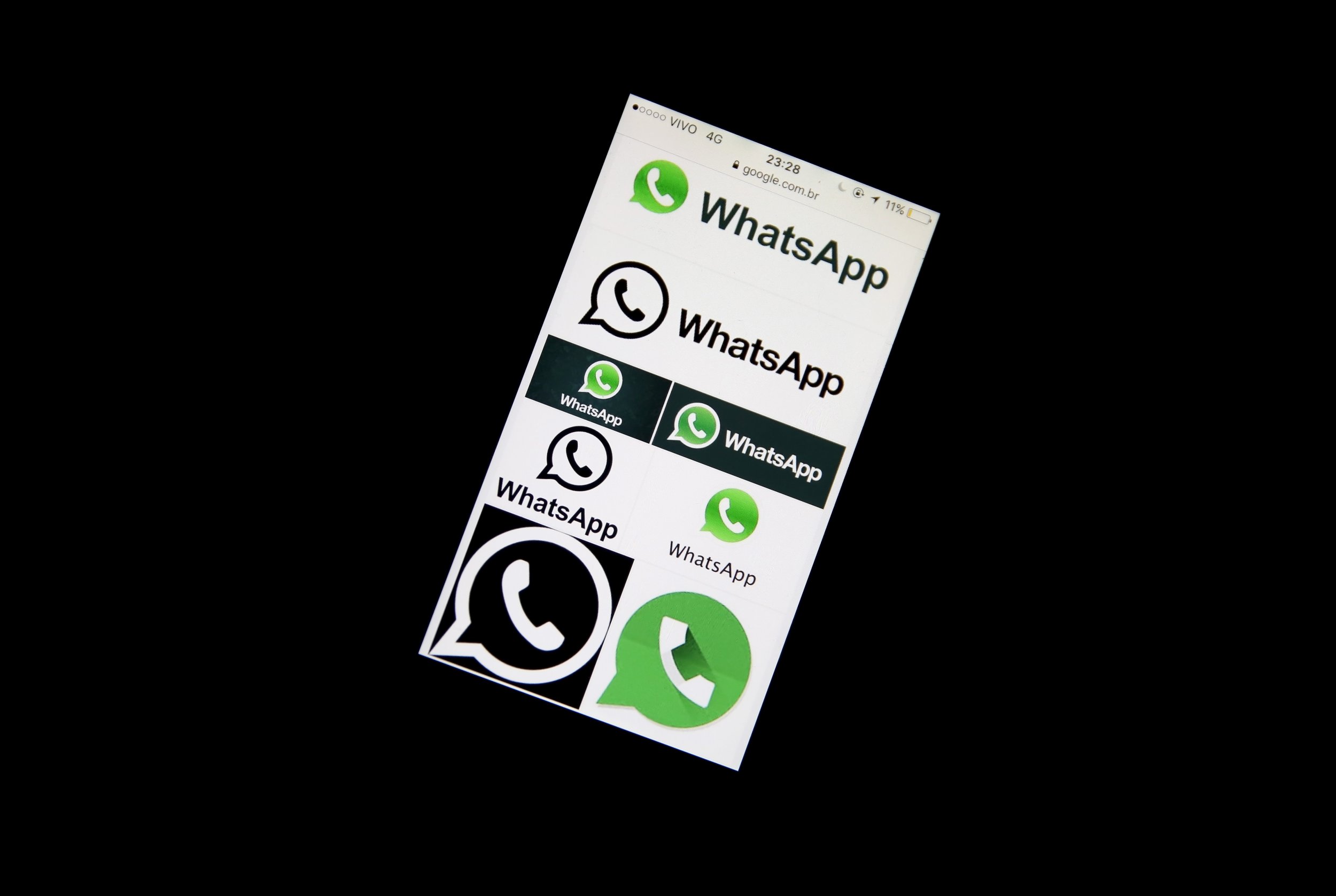Phone screen shows the WhatsApp logo