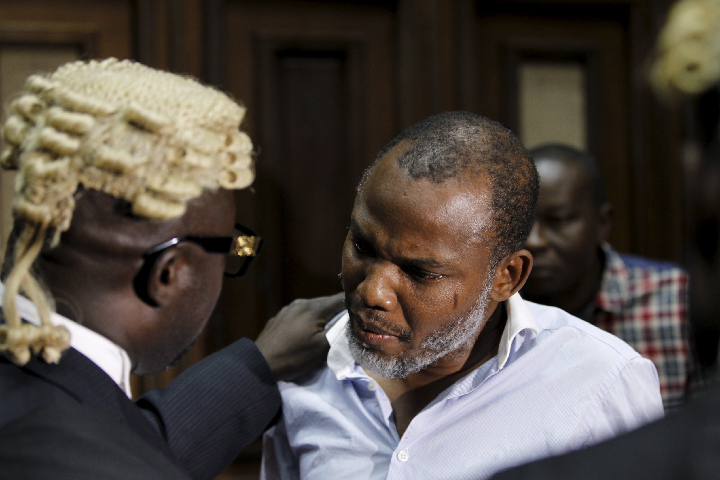 Biafran activist Nnamdi Kanu speaks to his counsel in a court in Abuja, Nigeria.