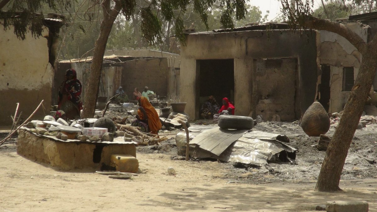 Dalori villagers rest after their houses were destroyed by Boko Haram.
