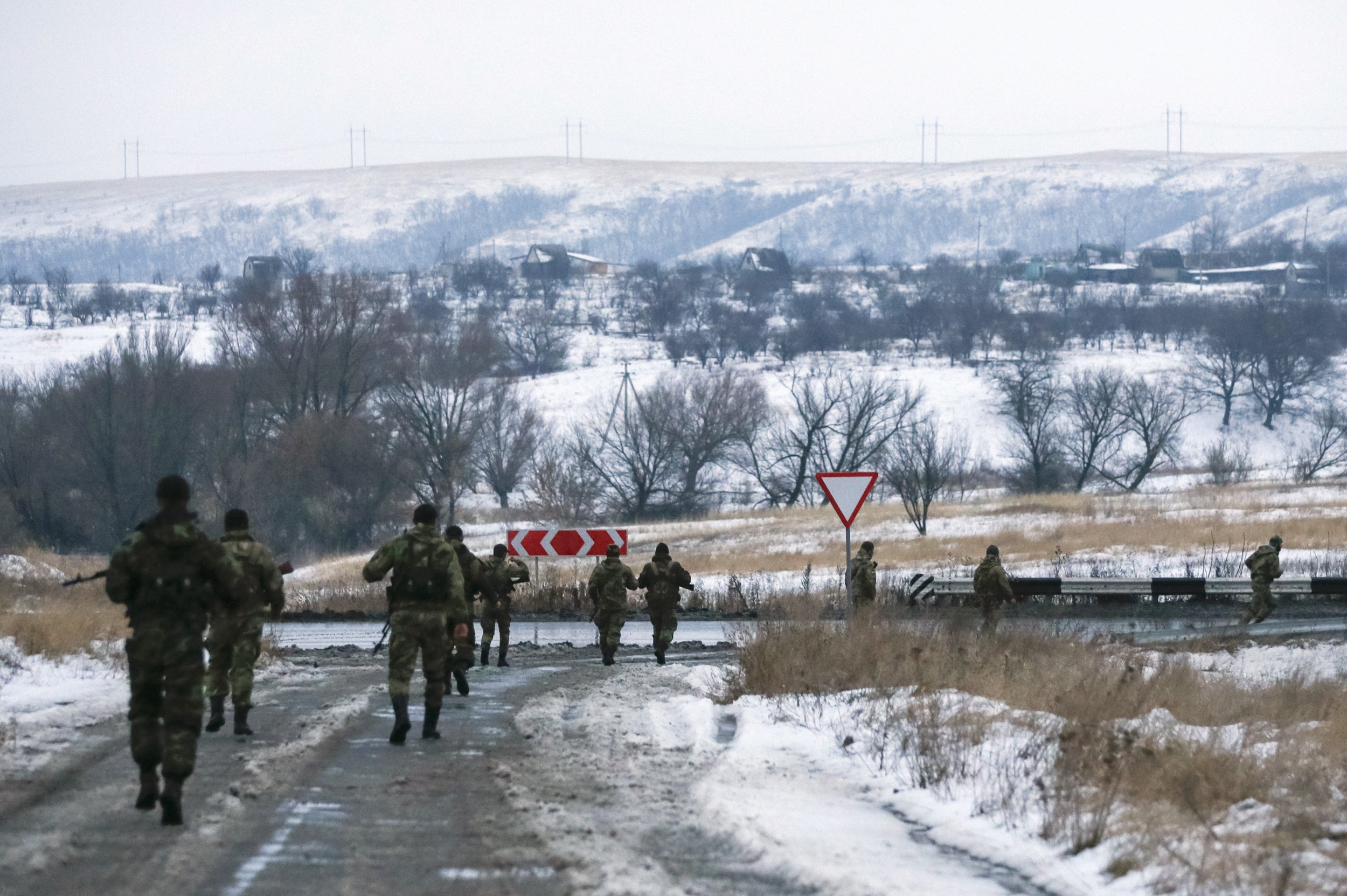 Chechen fighters march on a road in Donetsk region