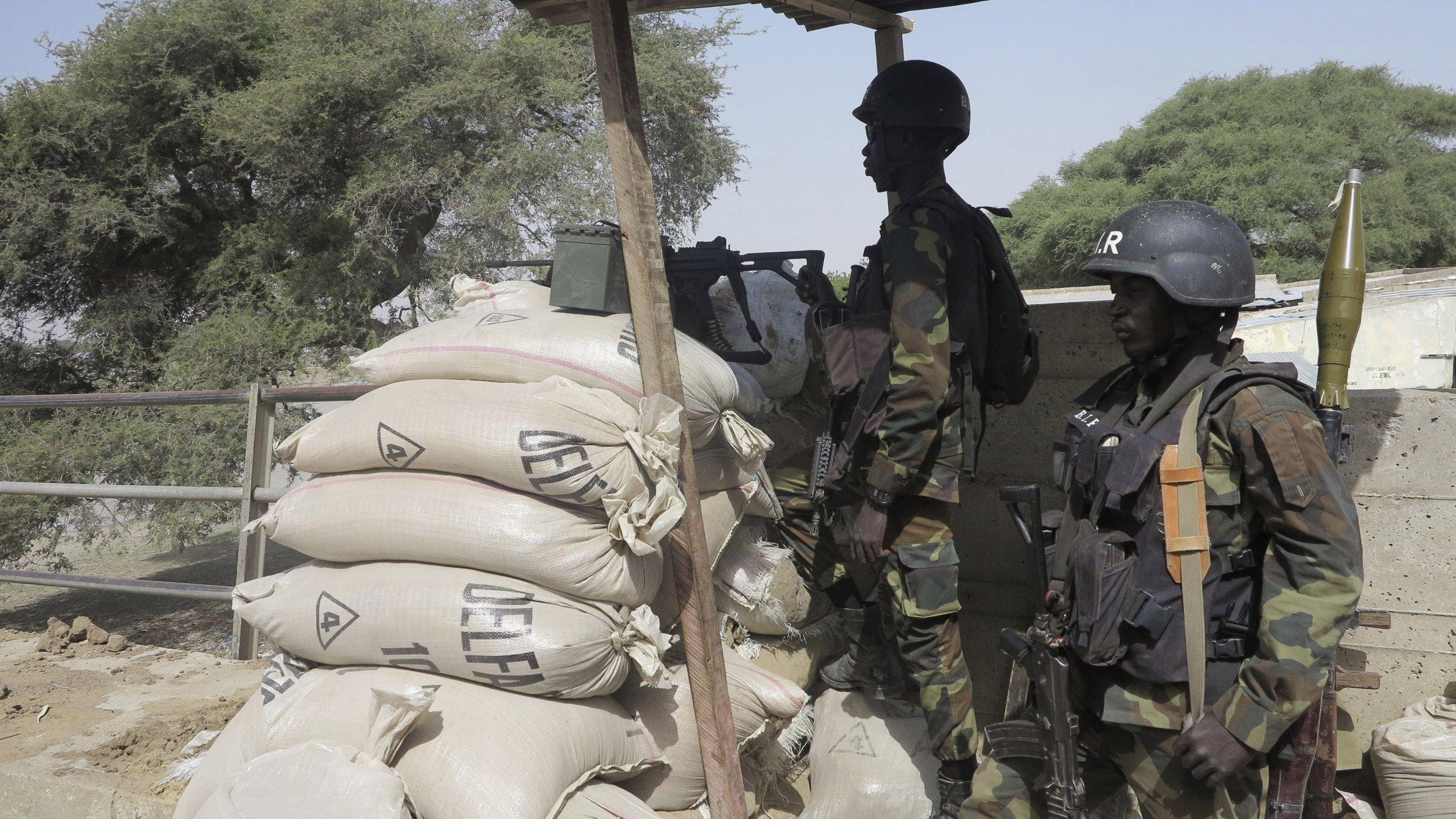 Cameroonian soldiers stand guard in an area attacked by Boko Haram.