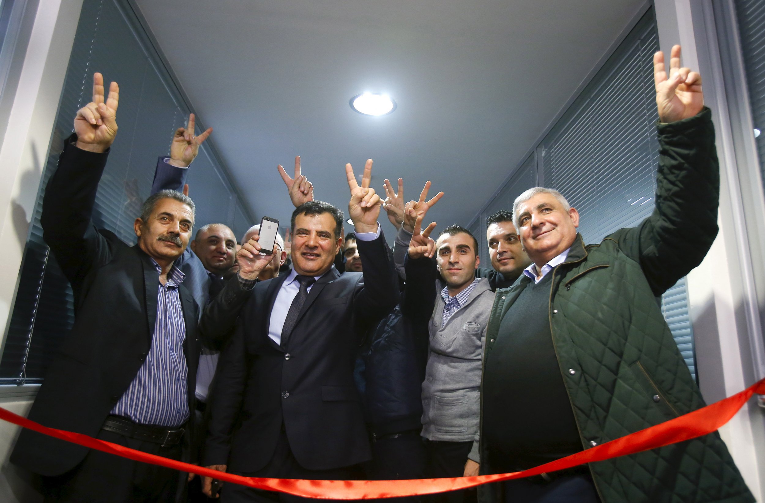 Syrian Kurdish activists cut the ribbon